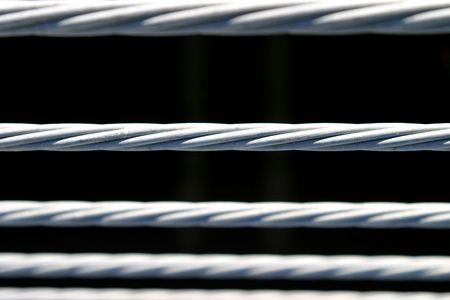 Metal fence wire on a black backgroundの写真素材