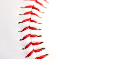 white leather base ball with red stitchingの写真素材