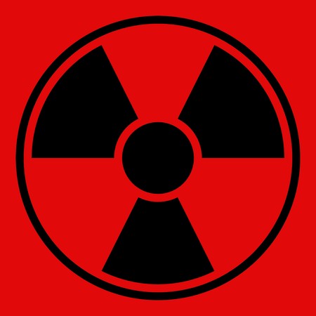 Round radiation warning sign on red backgroundの写真素材