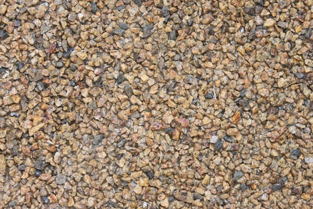 beige gravel small stones on the floorの写真素材