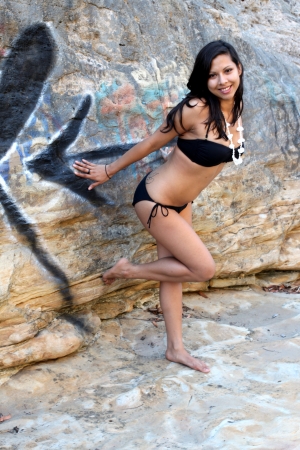 Young Hispanic woman with a black bikini の写真素材