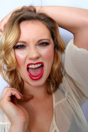 Portrait of a blond woman white background.の写真素材
