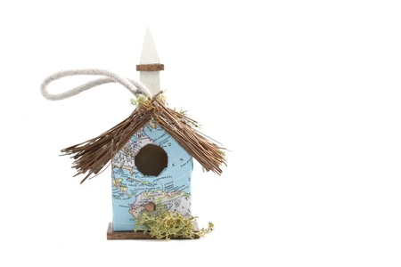 Very small  birdhouse with a map as wallpaper の写真素材
