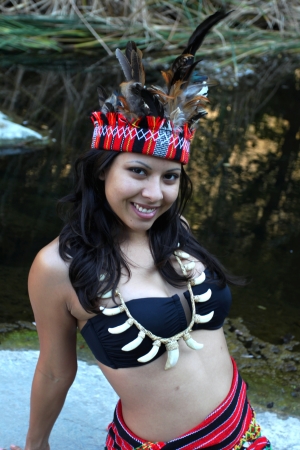 Native american woman posing next to a creek の写真素材