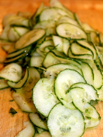 European cucumber sliced on a wooden board の写真素材
