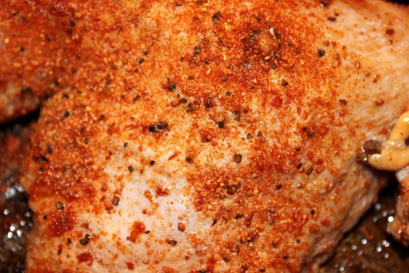 Closeup of chicken spiced with pepper and paprika の写真素材