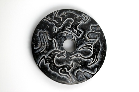 Closeup of black Chinese jade on white background.の写真素材