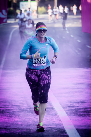 Ventura, CA - OCTOBER 18 :  Participants coming through the pink color station at The Color Run 2014...