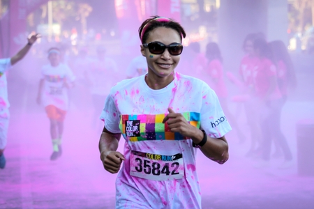 Ventura, CA - OCTOBER 18 :  Participants coming through the pink color station at The Color Run 2014...
