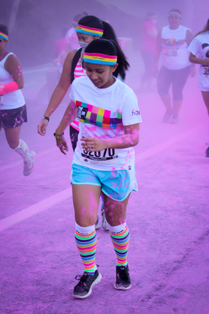 Ventura, CA - OCTOBER 18 :  Participants coming through the pink color station at The Color Run 2014...