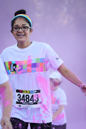 Ventura, CA - OCTOBER 18 :  Participants coming through the pink color station at The Color Run 2014 in Ventura. OCTOBER 18, 2014 in Ventura, CA.のeditorial素材