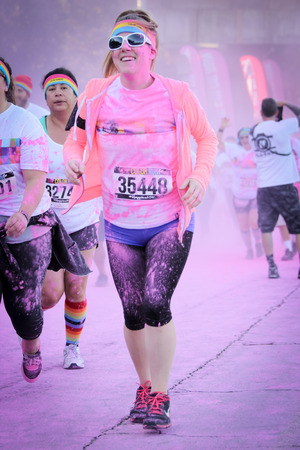 Ventura, CA - OCTOBER 18 :  Participants coming through the pink color station at The Color Run 2014 in Ventura. OCTOBER 18, 2014 in Ventura, CA.のeditorial素材