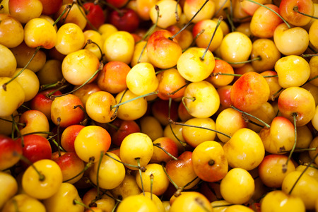 Ripe Red and Yellow Cherries Background