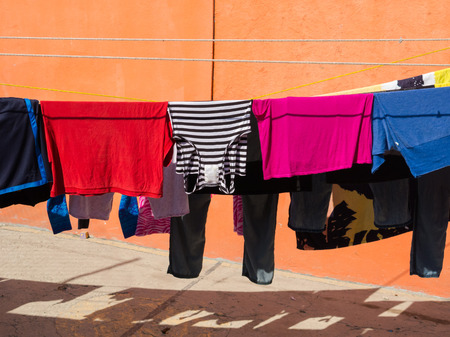 Clothing Hanging on Clothes Lineの写真素材