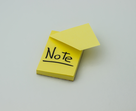 The yellow sticker with the inscription is on a gray background