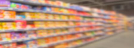 Out of focus banner consumption shelves in the supermarket with the eyes of a short-sighted personの写真素材