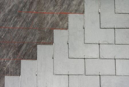 Roof slate rectangular double covering on roofing felt with marbling laid with stainless steel hooksの写真素材