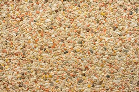 Background product sample closeup of an exposed aggregate concrete slab with pebbles light colorsの写真素材