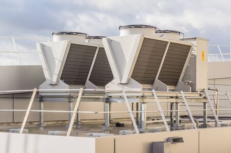 Building technology modern air water heat exchanger on a building roofの写真素材