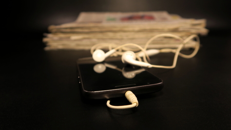 Smartphone and Newspaperの写真素材