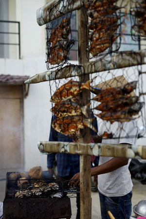 Food vendor cooks and sells Barbecue Grill fish at the street market in Banda Aceh Cityの写真素材