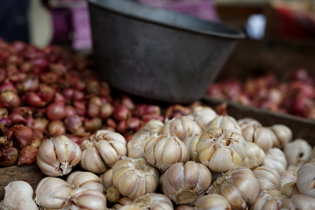 Bunches of Red Onions in vegetable marketの写真素材