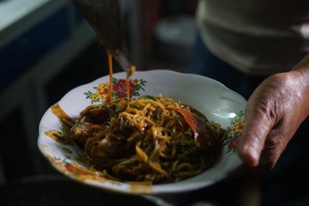 Mie Kepiting Aceh, Spicy  Seafood Noodle with Crab at Street food marketの写真素材