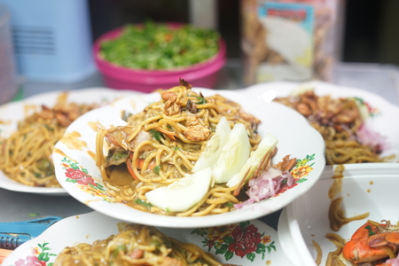 Mie Kepiting Aceh, Fired Seafood curry with crab and Noodleの写真素材