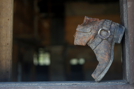 Old dusty vintage boot at abandoned buildingの写真素材