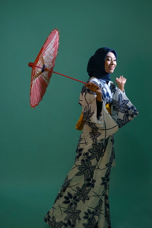 Young Japanese Muslim Girl in Kimono with umbrellaの写真素材