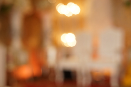 Defocused light and background with light spots of wedding decorationの写真素材