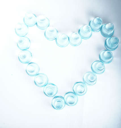 a Stack of Plastic Glass Mineral water in shape of heartの写真素材