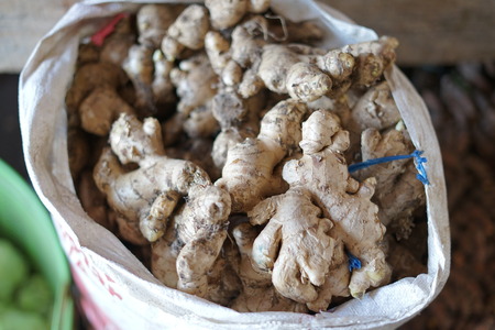 Closeup a pile of ginger roots at Traditional Vegetable Marketの写真素材