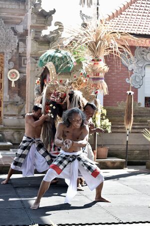 Bali, Indonesia - may 24, 2017: Balinese Debus player slicing the body by a machete at Art and Culture Festival in Bali Island, Indonesiaのeditorial素材
