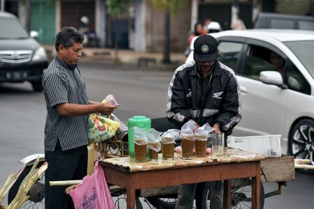 Banda Aceh, Indonesia â€“ July 7, 2015: Street Vendor sale Sugarcane fresh juice at Traditional...