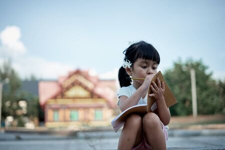 Asian little girl study from home during a virus  outbreakの写真素材