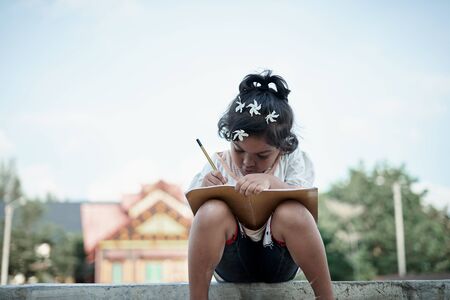 Asian little girl study from home during a virus  outbreakの写真素材