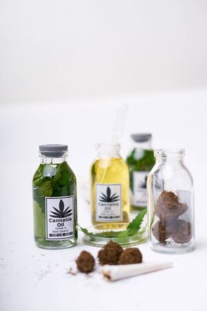 Marijuana Oil in the bunch of bottles. Concept of herbal alternative medicine, pharmaceutical industryの写真素材