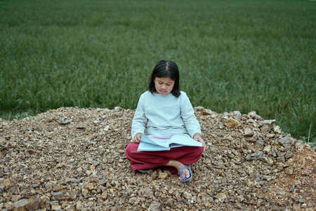 Asian Girl in school uniform study in rice field, New Normal for Education Concept