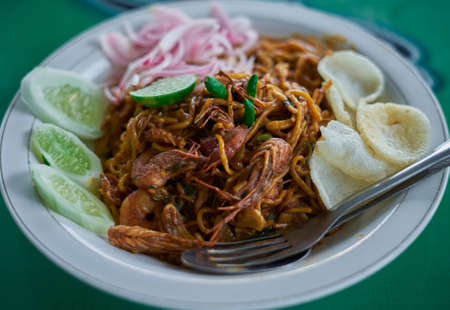 Delicious spicy Chinese noodles with shrimps at Indonesian street food marketの写真素材
