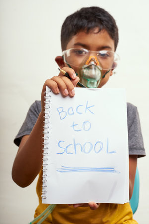 Schoolboy just bored of online classes and wanted Back to school. Home Education concepts