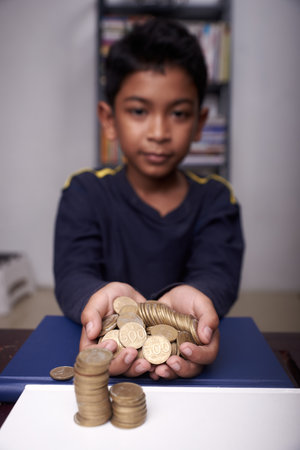 Asian boy saving money for educationの写真素材