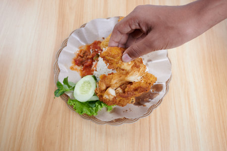 Fried squid with spicy sauce on wood table background, stock photoの写真素材