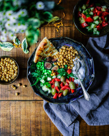 Fresh fruits in bowls kept on a tableの写真素材