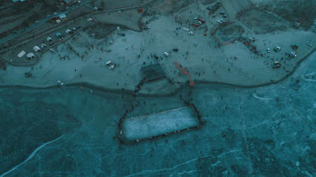 Bird eye view of frozen Khalti lake during winter sports festival in Ghizer Valleyの写真素材
