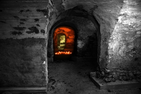 Empty abandoned dungeon with red candles lightの写真素材