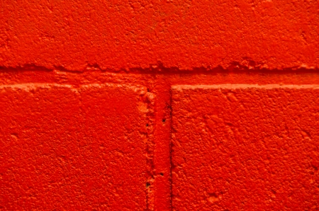 Close-up red concrete brick painted wallの写真素材