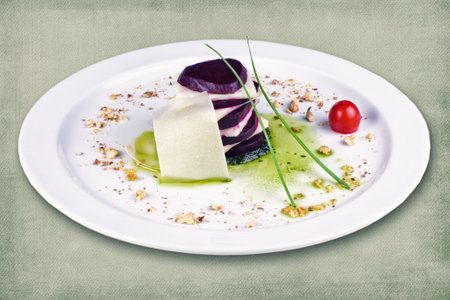 restaurant dish consisting of beets with cheese and herbsの写真素材