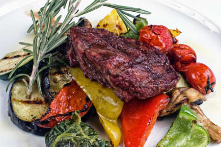 restaurant dish consisting of roasted meat with vegetablesの写真素材
