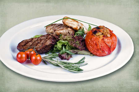 restaurant dish consisting of roasted meat with vegetablesの写真素材